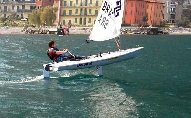 Brad Gibson foiling a Laser on Lake Garda, Italy © Glide Free